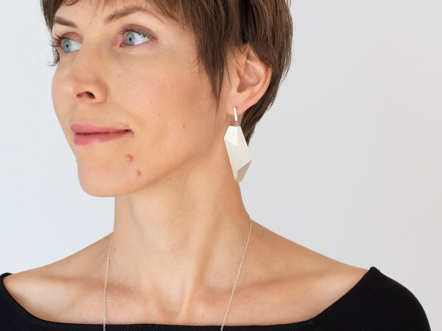 Long sculptural earrings in sterling silver