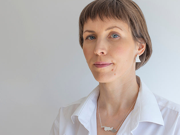Woman with geometric silver jewelry