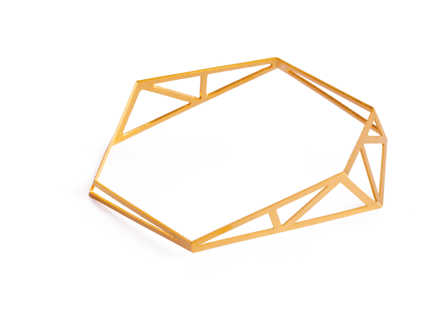 Architecture inspired geometric gold bangle made of folded and cut out metal sheet. Inspired by steel constructions, lightweight, three-dimensional