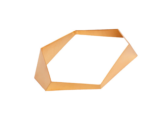 Geometric gold bangle from folded metal sheet. Variable width, dynamic lines create eye catching shape